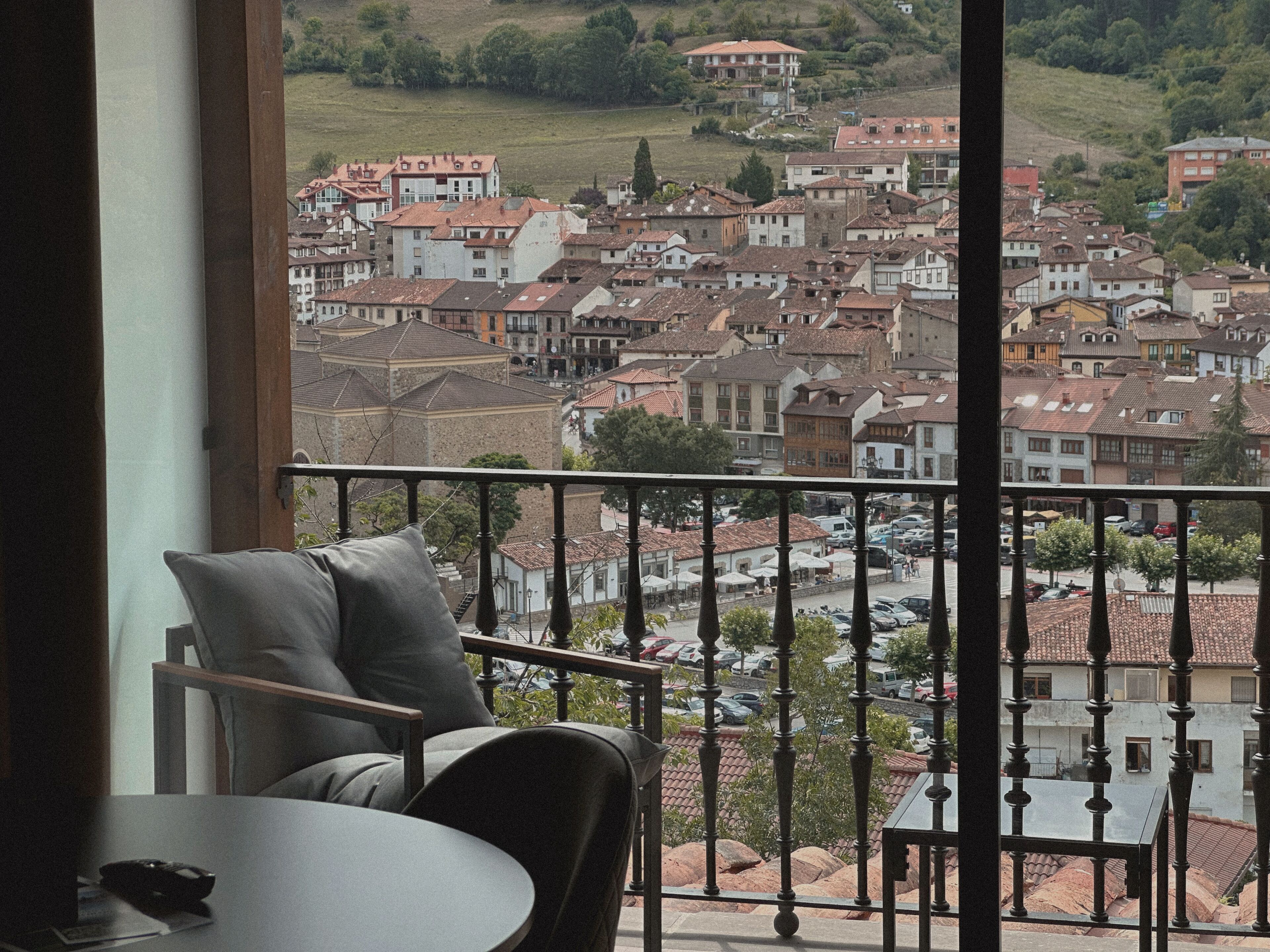 A balcony with a view of a town.
