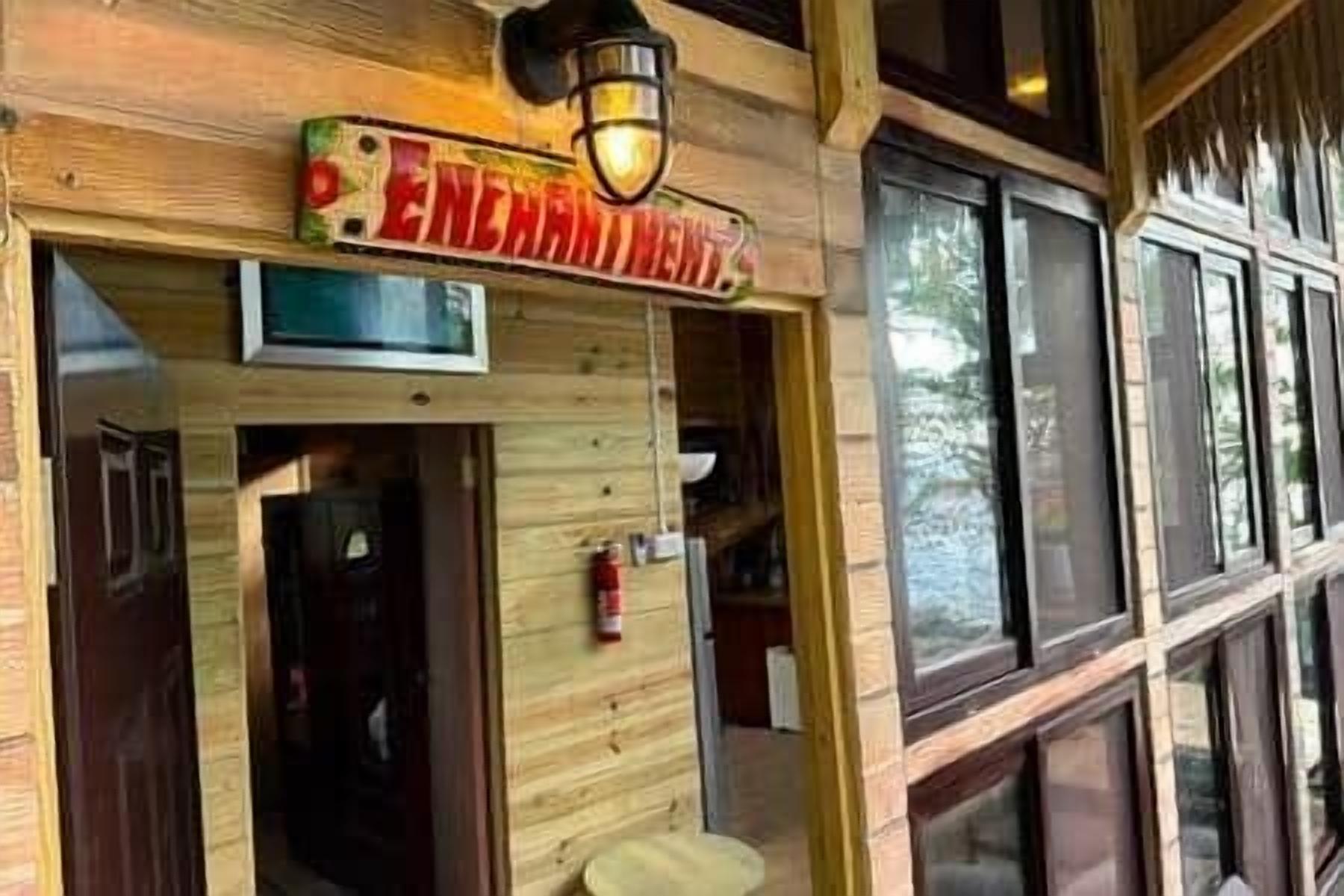 A wooden exterior with a sign reading "ENCHANTMENT."