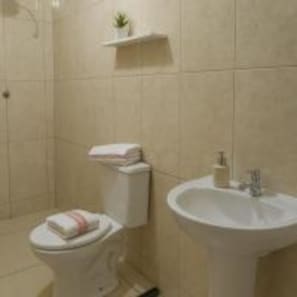 Twin Room | Bathroom | Shower, towels, soap, toilet paper