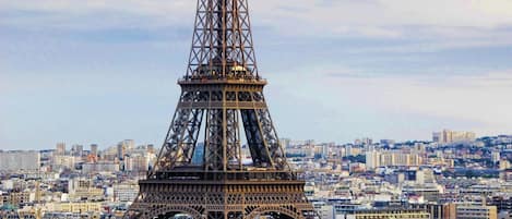 The Eiffel Tower in Paris with surrounding cityscape.