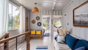 A modern interior with a bed, sofa, and a staircase. - House Near the Beach and Beto Carrero Efp0356 (Penha)