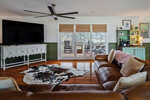 Smart TV, fireplace, books, printers