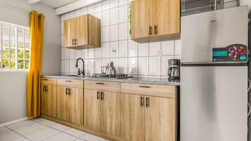 Fridge, microwave, stovetop, coffee/tea maker