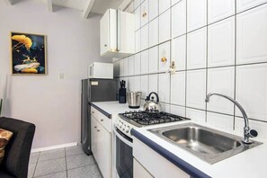 Fridge, microwave, stovetop, coffee/tea maker