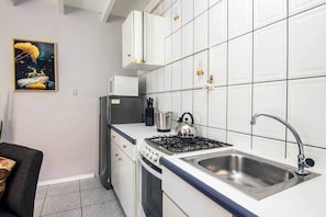 Fridge, microwave, stovetop, coffee/tea maker