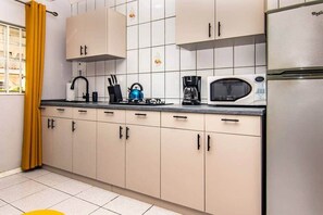 Fridge, microwave, stovetop, cookware/dishes/utensils