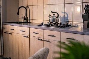Fridge, microwave, stovetop, coffee/tea maker