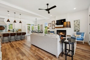 Smart TV, fireplace, books, printers