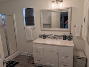 Shower, hair dryer, towels, soap