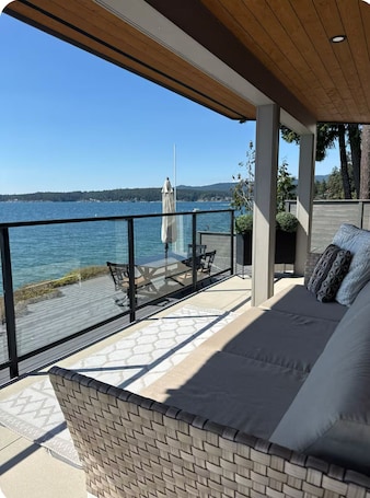 Outdoor dining. Halfmoon bay 2-bedroom waterfront house with kayak access to island