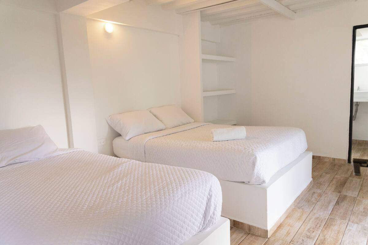 Comfort Room | Desk, bed sheets