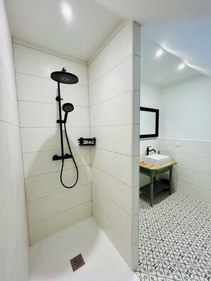 Shower, hair dryer, towels, toilet paper