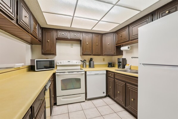 Apartment, Multiple Beds, Balcony, Pool View (Pelican Inlet C222) | Private kitchen | Coffee/tea maker