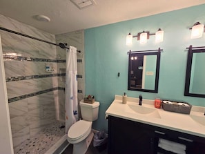 Shower, jetted tub, hair dryer, towels