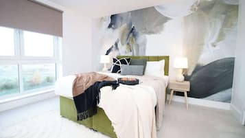 2 habitaciones, tabla de planchar con plancha, cuna de viaje y wifi