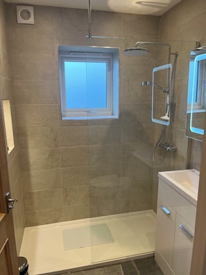 Shower, towels, soap, toilet paper