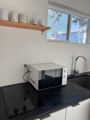 Fridge, microwave, stovetop, coffee/tea maker