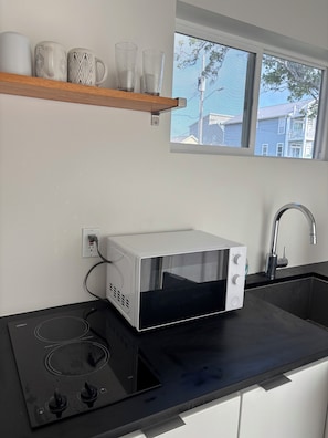 Fridge, microwave, stovetop, coffee/tea maker