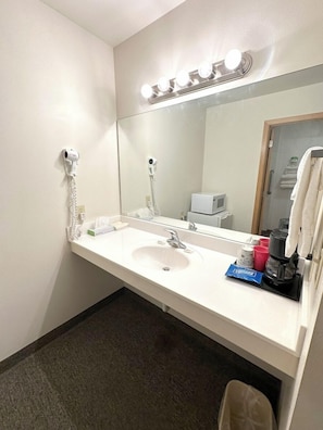 Combined shower/tub, hair dryer, towels, soap