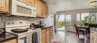 King bedroom. Spacious living room. Dining area with glorious view. Full kitchen