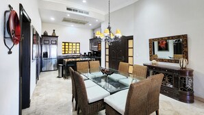 A modern kitchen with a dining area. -  2 Bedroom condo in Villa la Estancia in Nuevo Nayarit (Nuevo Nayarit)