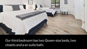 A bedroom with two queen-size beds, two closets, and an en suite bathroom. - NWA Getaway Pool, Arcade, Trails (Springdale)