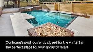 A backyard with a swimming pool, wooden deck, and a covered seating area. - NWA Getaway Pool, Arcade, Trails (Springdale)