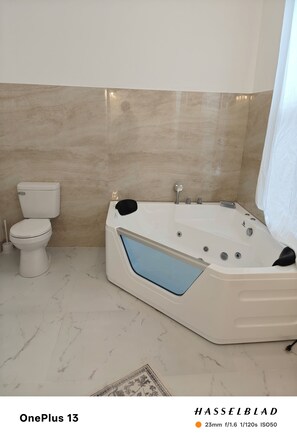 Jetted bath, hair dryer, towels, soap