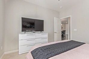 Luxury Condo, 2 Bedrooms, Balcony, Pool View | Individually furnished, desk, laptop workspace, blackout drapes