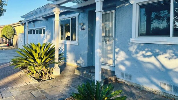 A residential building with a garage, a covered porch, and a number '1716' on the wall. - Beauty Home 3Br/2Bath Nearby Downtown in San Jose (San Jose)