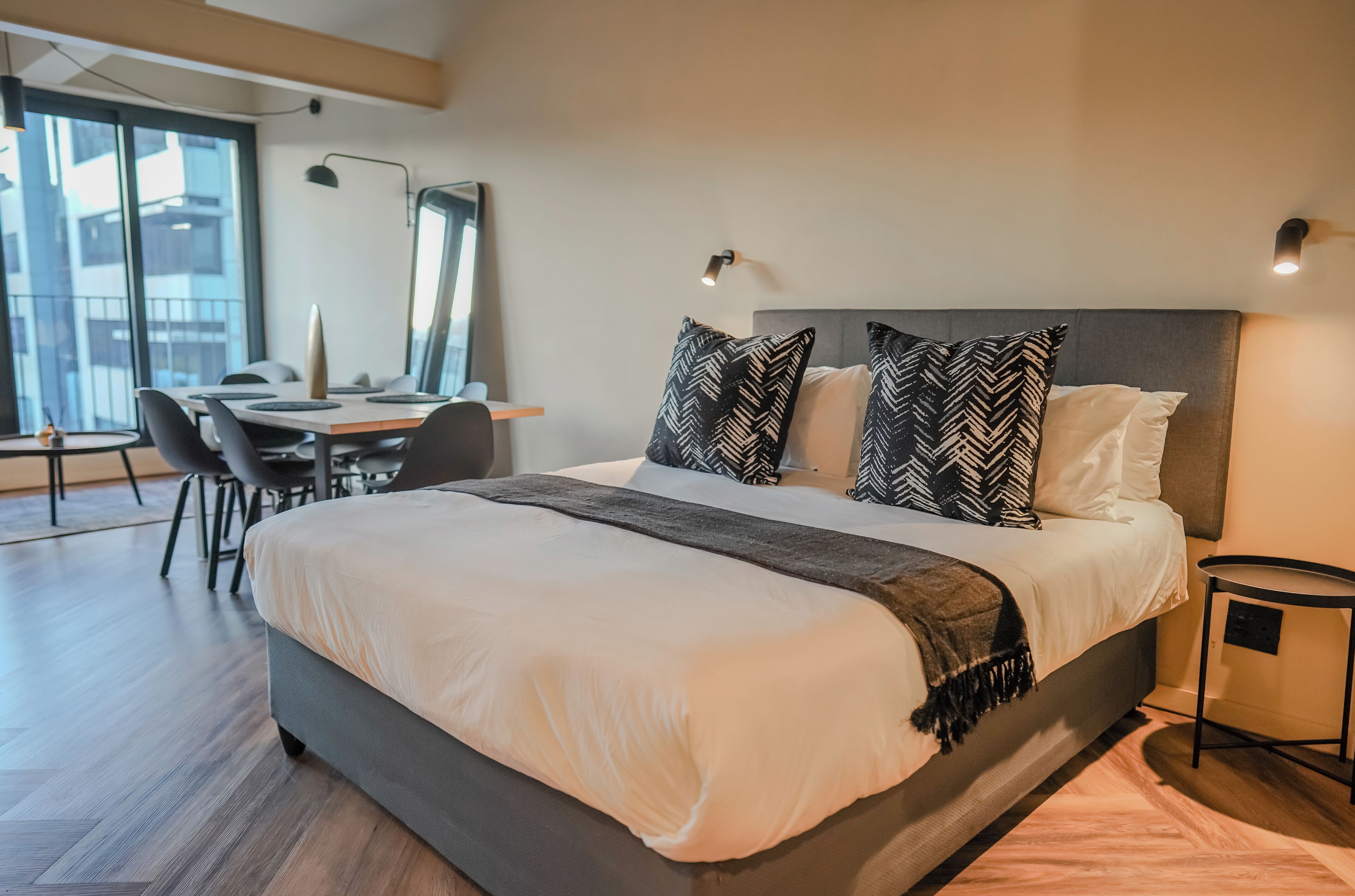 Deluxe Apartment, 2 Bedrooms, Balcony, City View | In-room safe, desk, laptop workspace, iron/ironing board