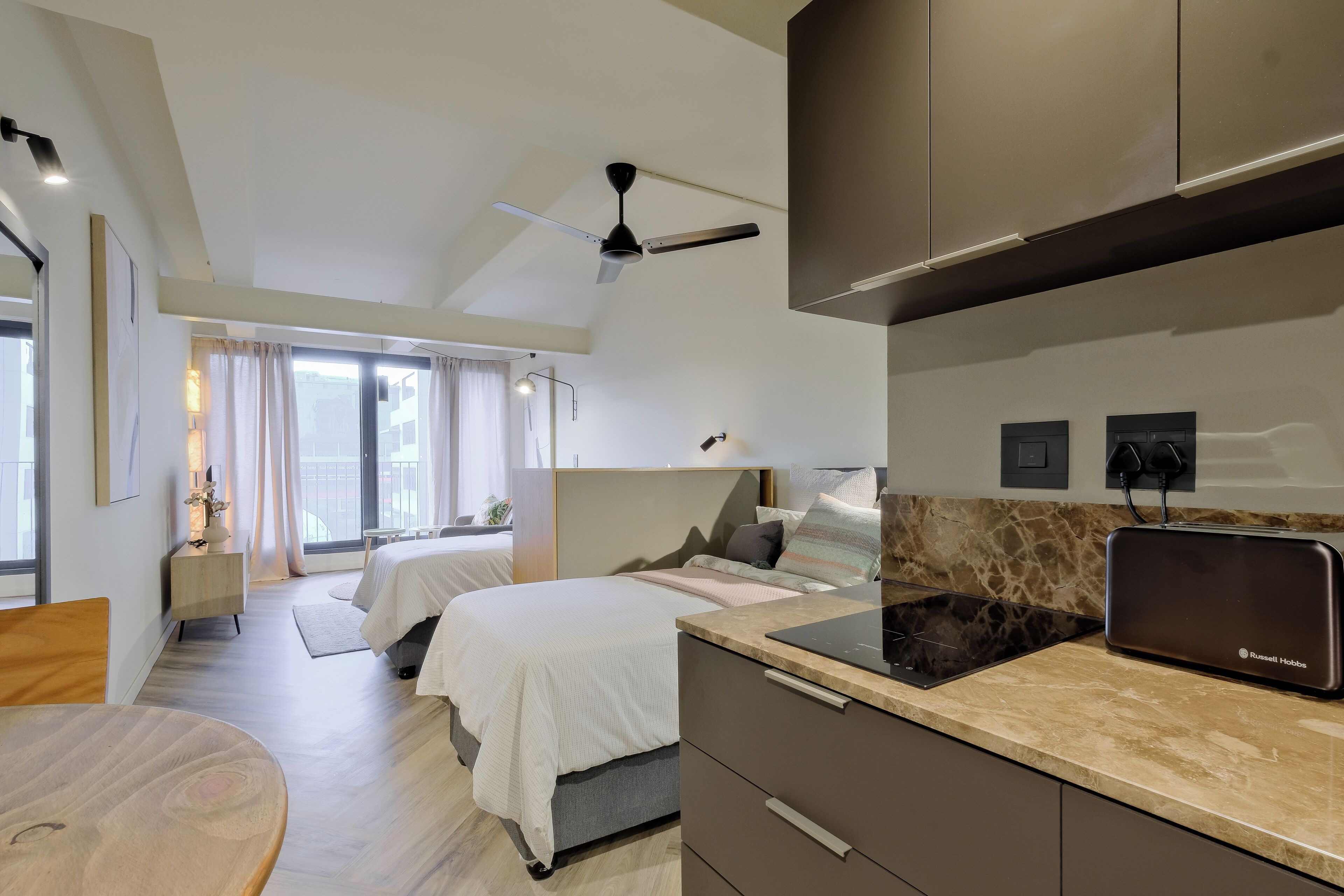 Deluxe Studio, Balcony, City View | In-room safe, desk, laptop workspace, iron/ironing board