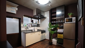 A compact kitchen with a refrigerator, microwave, stove, sink, and cabinets. - TraditionalJapanese Vacation house near to metro station, 4 bedroom Multiple bath (墨田区)