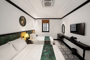 Family Triple Room, Non Smoking | Hypo-allergenic bedding, desk, laptop workspace, blackout drapes