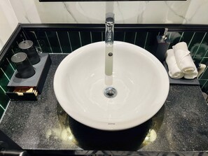 Shower, hair dryer, slippers, towels