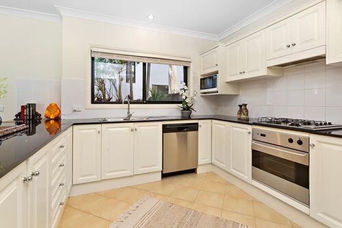 On little Austinmer beach encircled by resturants to surf,swim,fish, boat or ski