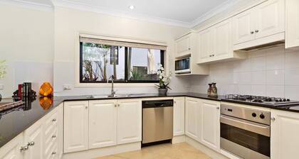 On little Austinmer beach encircled by resturants to surf,swim,fish, boat or ski