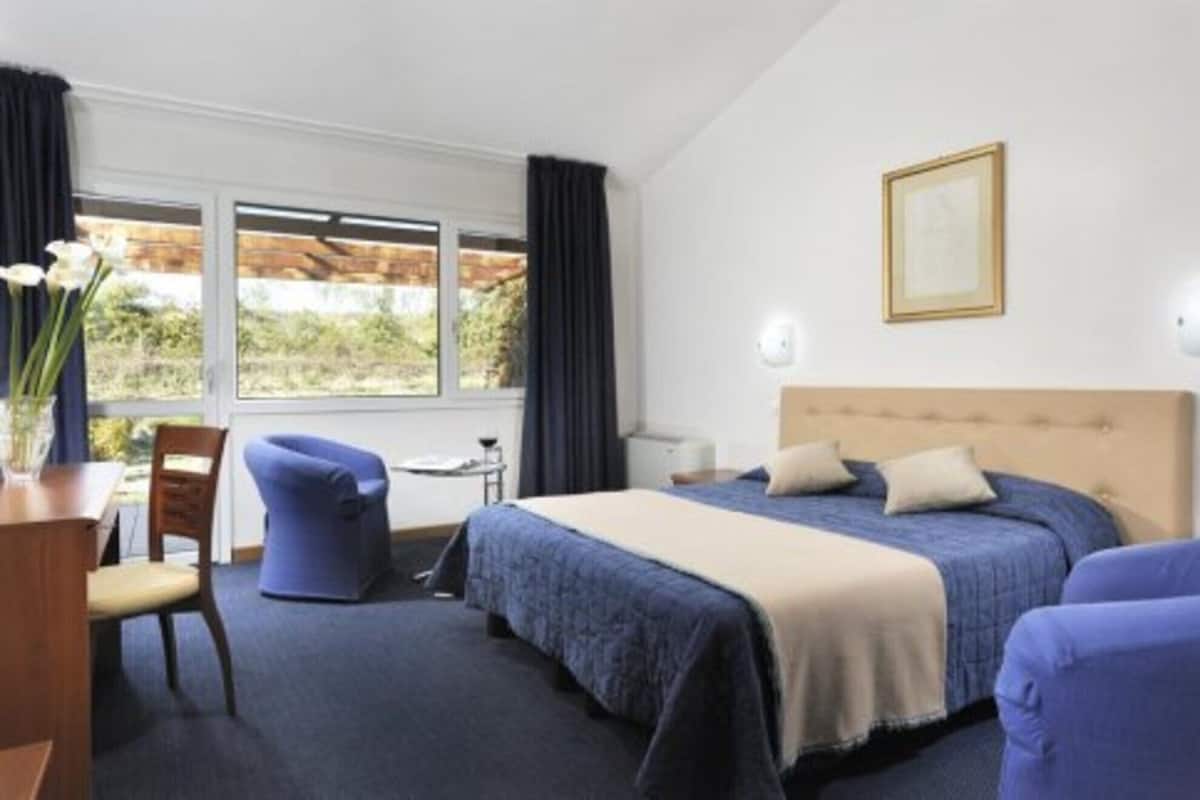 In-room safe, desk, laptop workspace, blackout curtains