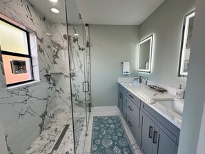 Shower, hair dryer, towels, soap