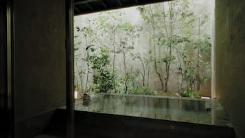 Japanese-style House, Garden View | Bathroom | Combined shower/tub, hair dryer, slippers, towels