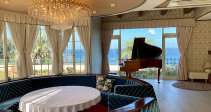Luxrious double room with mountain view and ocean view from the balcony and an interior window / Hamada Shimane