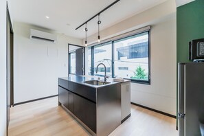 Fridge, microwave, cookware/dishes/utensils