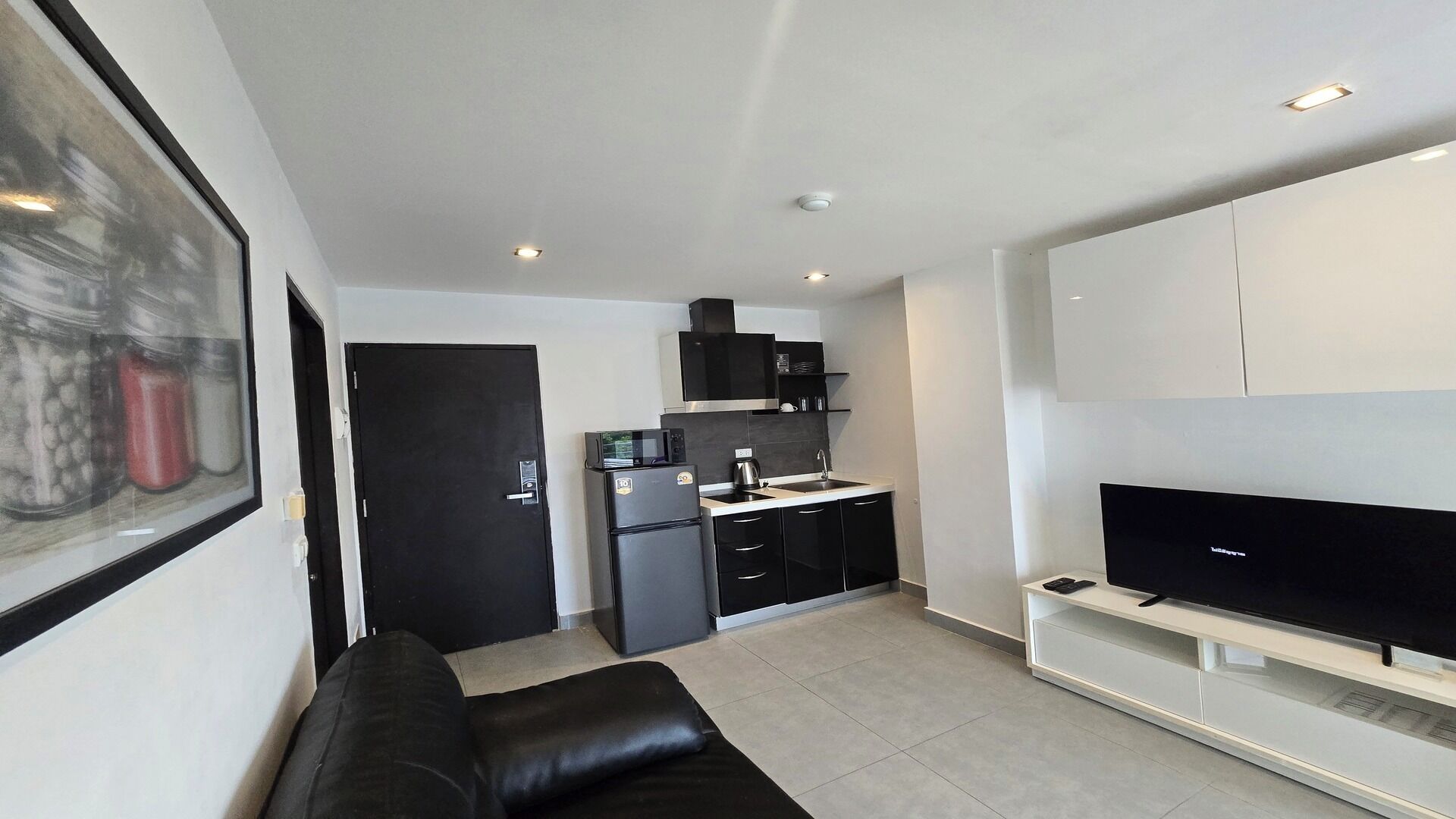 Apartment, Balcony, City View | Living area | Flat-screen TV