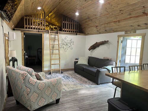Secluded cabin in the woods with a loft on 25 acres with private walking trails.
