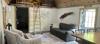 Secluded cabin in the woods with a loft on 25 acres with private walking trails.