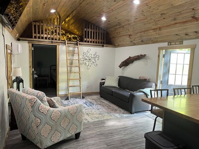 Secluded cabin in the woods with a loft on 25 acres with private walking trails.