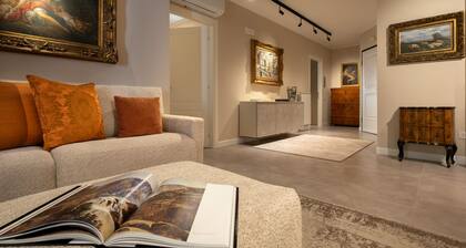 Rooms with contemporary furnishings, artwork and old paintings.