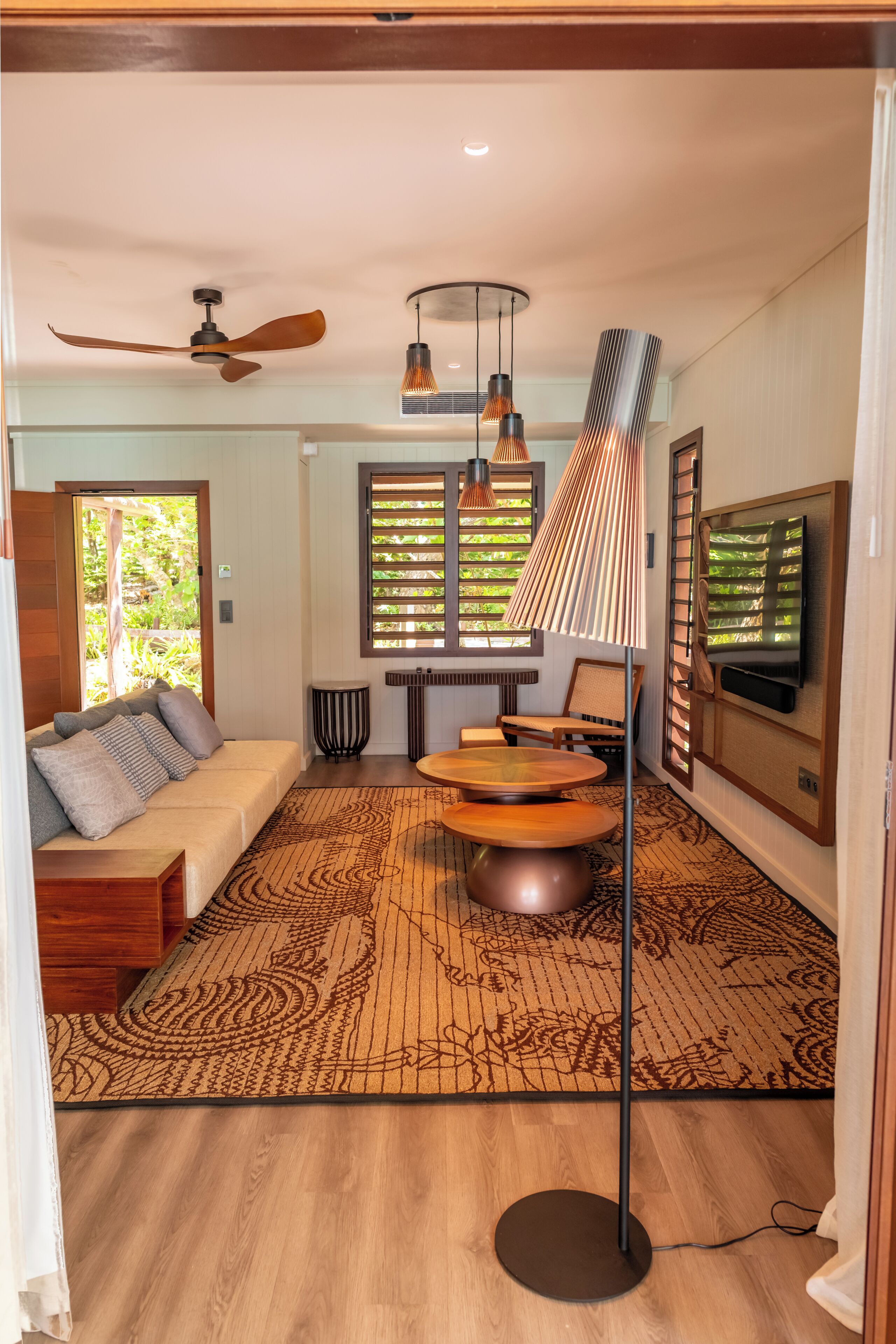 Luxury Suite, Ocean View | Living area | 65-inch TV with satellite channels