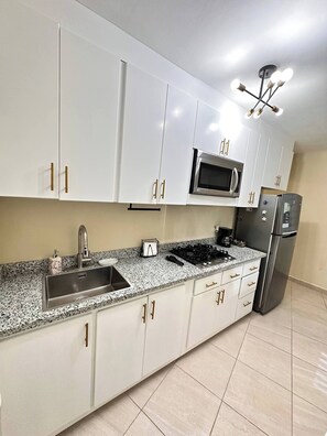 Fridge, microwave, coffee/tea maker, toaster