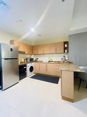 Fridge, microwave, stovetop, coffee/tea maker